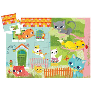 Full puzzle features 8 cats playing around. Some are in a a  house, some are in a tree, and some are in the grass.