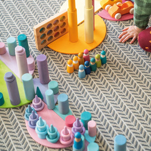 large pastel semicircles; being used a floor/base for building a scene