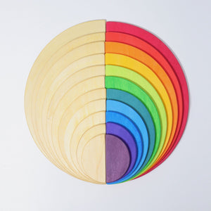 large natural semicircles stacked with larger rainbow semicircles to create a complete circle