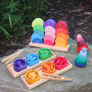 rainbow bowls sorting game next to moon stacking game