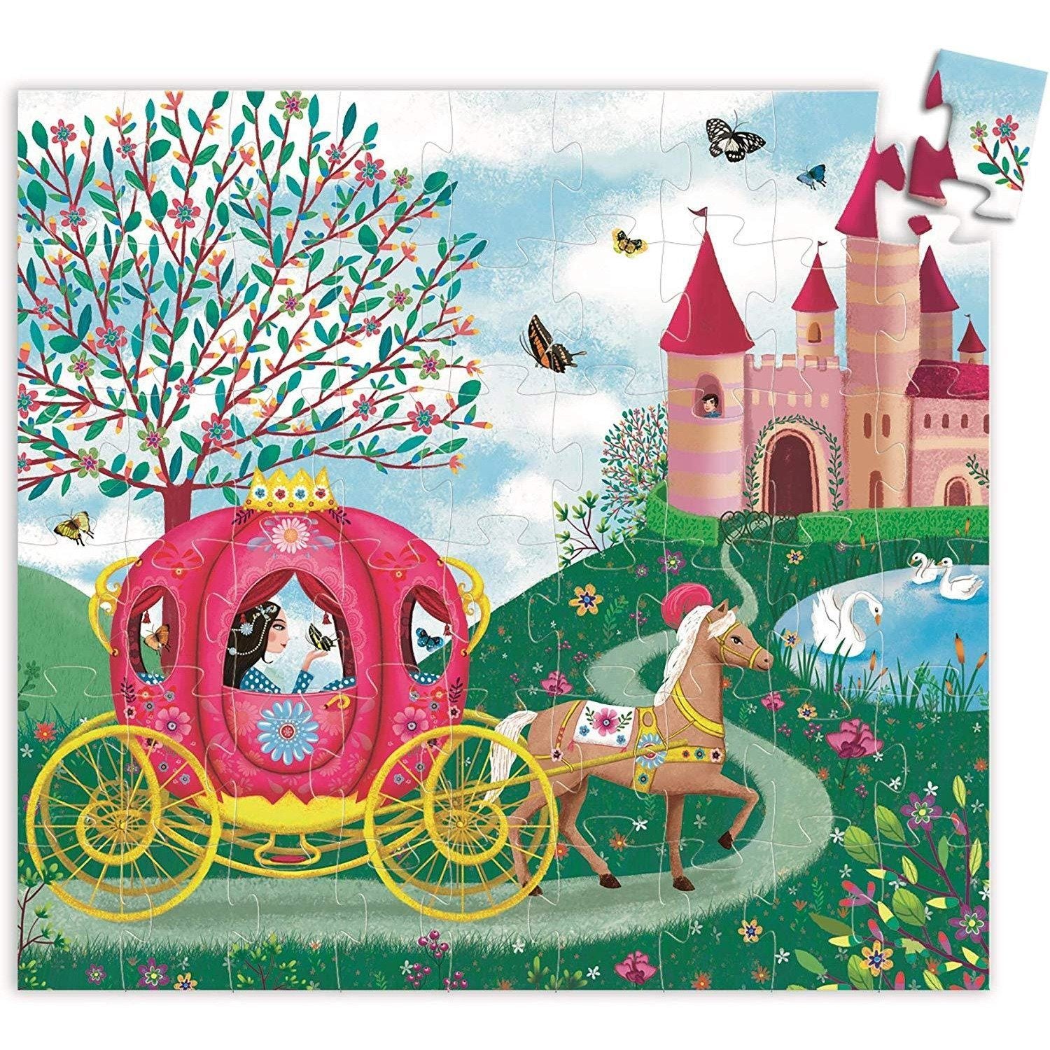 Box for Elise's carriage puzzle in the shape of a carriage. The carriage is bright pink , there are flowers on the ground, and butterflies featured.