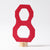 A wooden number 8 figure stained red.