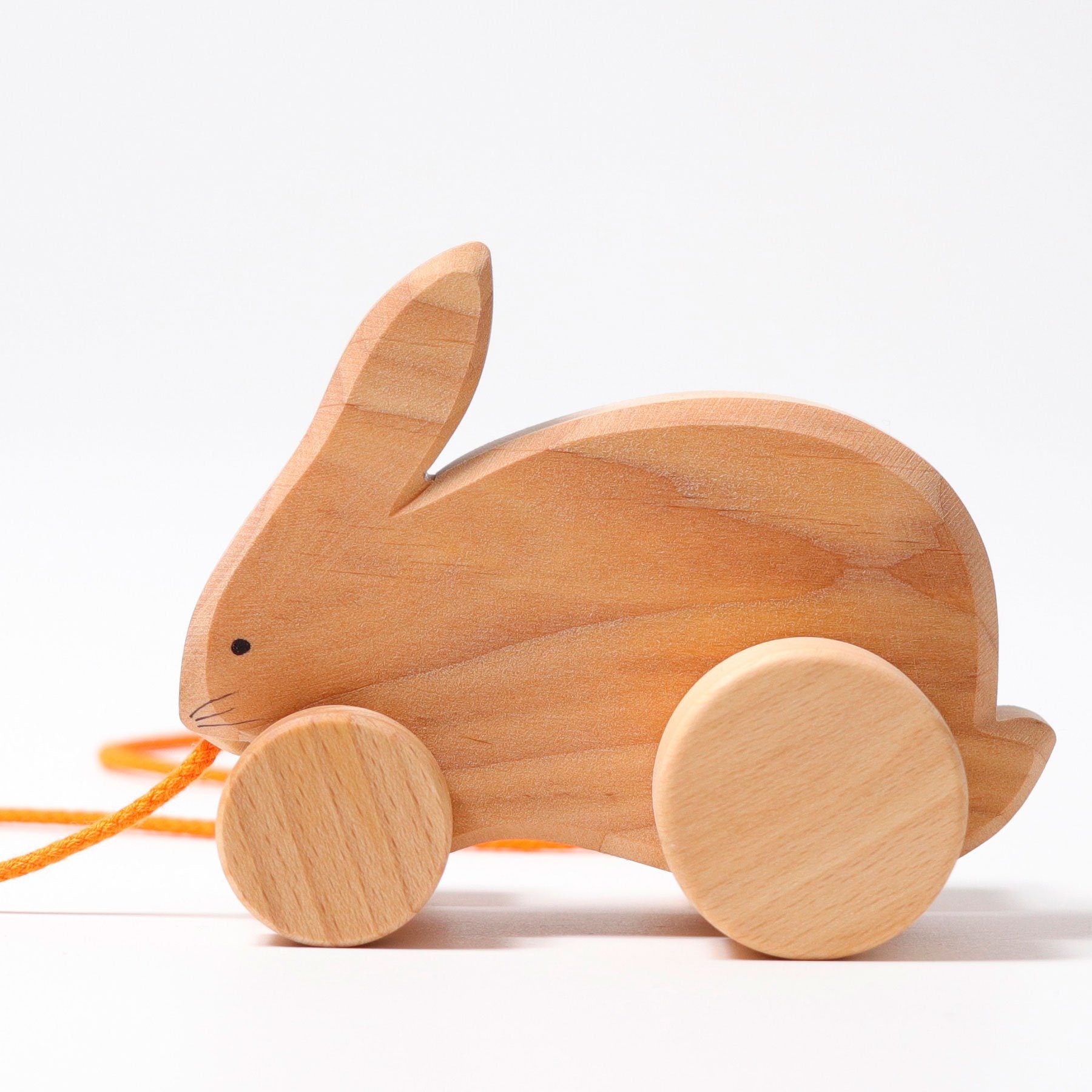 bobbing rabbit hans pull toy, natural wood with orange string