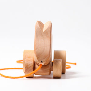 bobbing rabbit hans pull toy, natural wood with orange string; front view