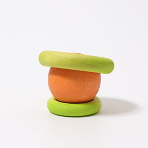 large and small lime green rings stacked on bottom and top of orange ball