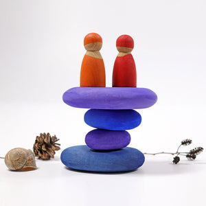 dream pebbles stacked with two peg people standing on top