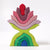 Nine-piece wooden flower sculpture.The five top pieces are in shades of pink and red. The bottom four pieces are in shades of green and blue.
