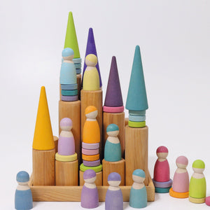 large natural building rollers in frame; rollers are standing vertically; grimm's pastel friends, coins, and forest also pictured