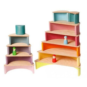 large natural semicircles stacked with pastel rainbow to create dollhouses