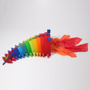 triangular pieces are used with the large twelve-piece rainbow and silk scarves to create a dragon.