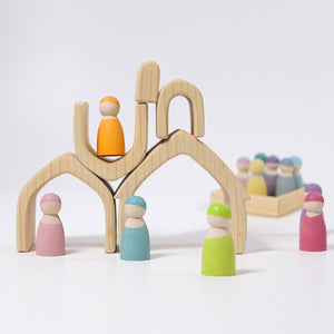 natural house pieces stacked on each other with pastel peg people