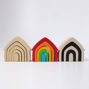natural house next to rainbow and monochrome houses