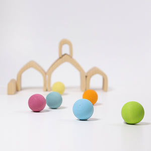 natural house pieces used as tunnels with pastel balls