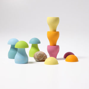 pastel mushrooms; some bottom pieces stacked on top of each other