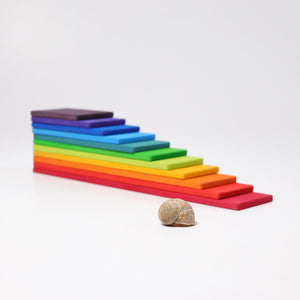 rainbow building boards with sea shell in front