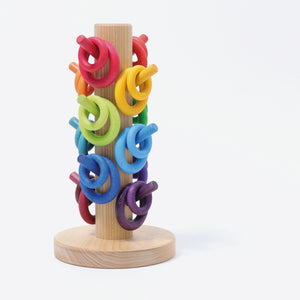 building rings sorted on matching colored dowels of sorter