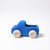 A wooden truck painted blue with natural wheels. Side view.