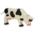 A wooden cow figure paint white with black spots and a pink utter and nose.