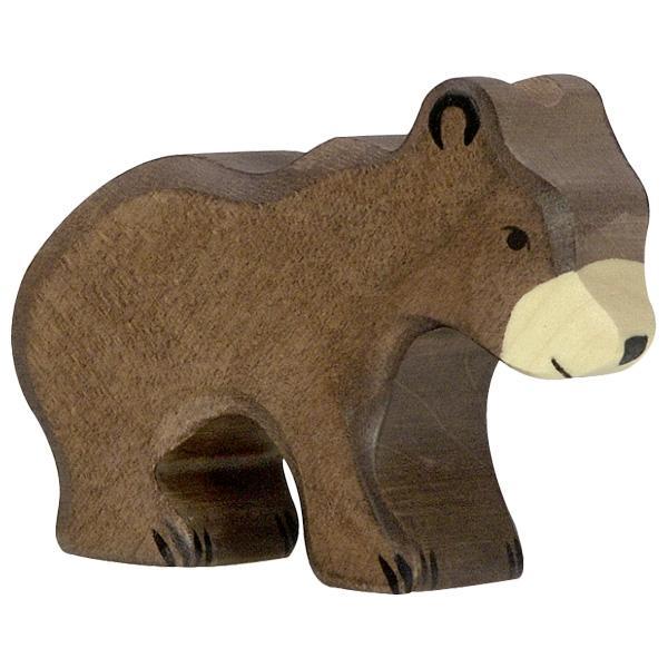 A small bear wooden figure painted brown with a white nose/mouth and dark paint used for face and claw detailing. The cub is standing on all fours with its head level to its body.
