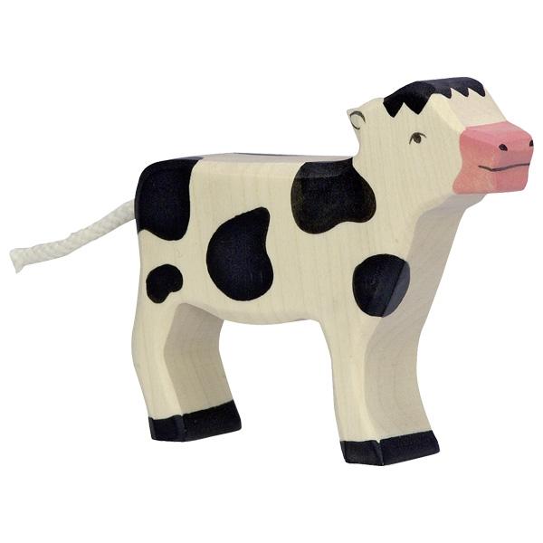 A white calf figure with black spots and a pink nose.