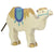 A wooden camel figure painted off-white with tan hair on its head and back. The saddle on its back and straps on face are teal and blue. Also has tan hoofs.