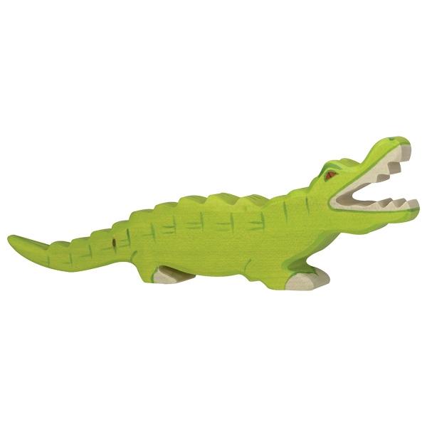 A crocodile wooden figure painted bright green with orange/red eyes. Its mouth is open with white paint used for the teeth and feet. A darker green paint is used to make it look like it has scales