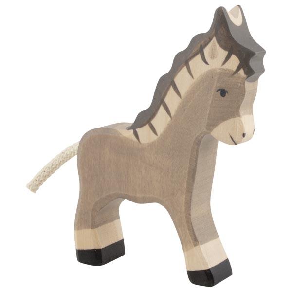 A donkey wooden figure painted primarily grey. White is used to detail the ears, face, and ankles. Black is used to detail the hooves and face detailing.