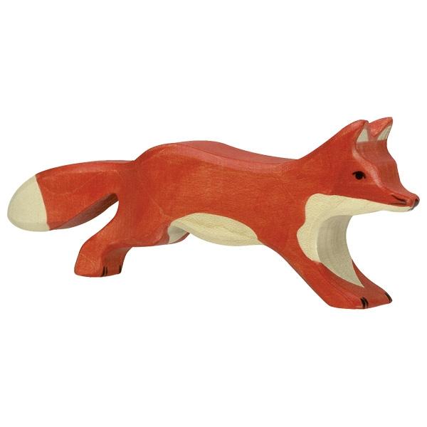 A wooden figure fox with orange paint as the fur. It has a white chest, underbelly, and tail-tip.