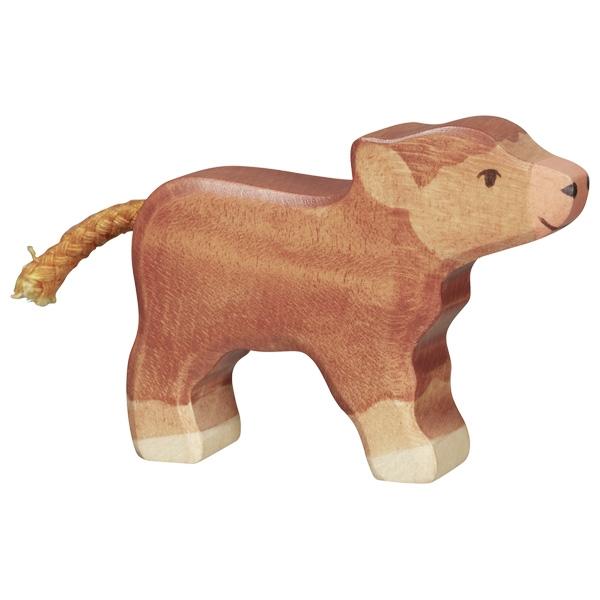 A Scottish Highland cattle wooden figure. It has dark brown hair, a light brown face and feet.