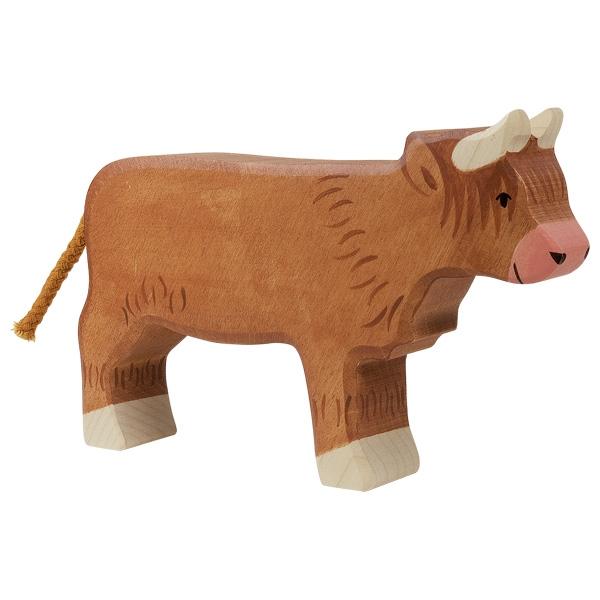 A wooden Scottish Highland cattle painted brown with dark brown hair detailing. The horns and hooves, pink nose, and black paint used for face detailing.