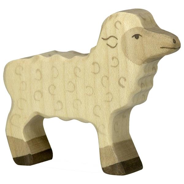 A lamb wooden figure painted primarily white/neutral with grey swirls to look like fur. Grey paint is also used to define the face and legs that do not have fur. Dark grey paint is used to detail the face, ears, and feet.