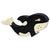 A orca whale wooden figure painted white and balck.