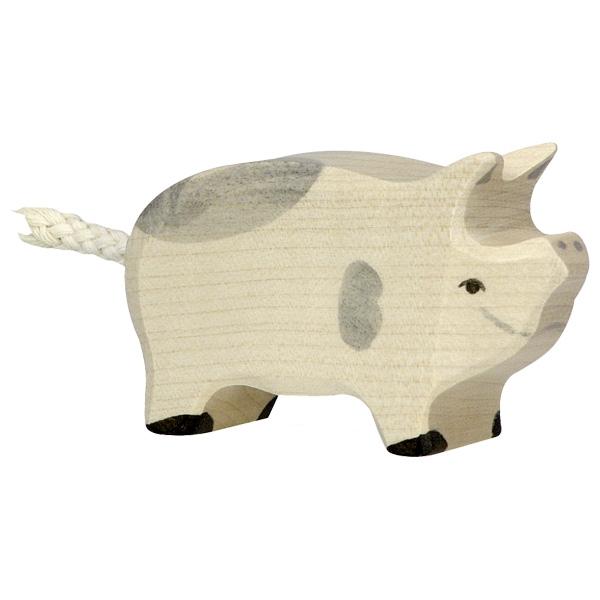 A wooden piglet figure with grey spots and a white rope used as the tail