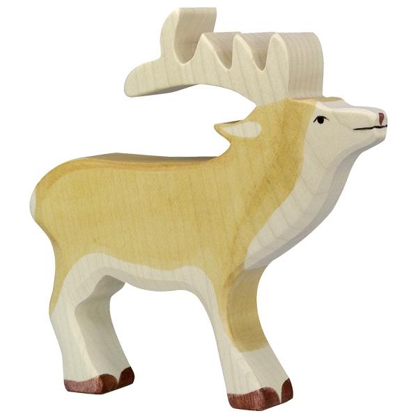 A stag wooden figure with white horns, a white chest, and white underbelly. A tan color is used for the body. Dark brown paint is used for face and feet details.
