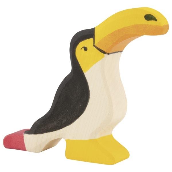 A toucan wooden figure with a red tail, black back, and white/natural underbelly. Yellow is used on the face, bill, and feet.